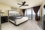 Master bedroom with king bed and balcony access